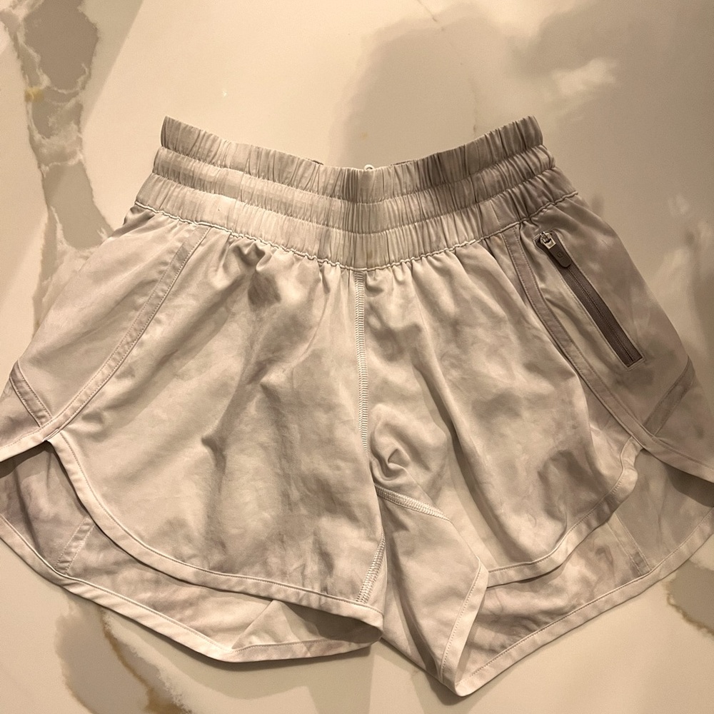 Like new size 4 Lululemon grey/white running shorts